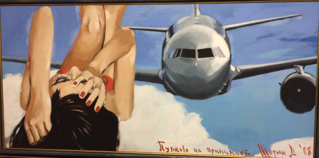 Dmitry Shorin's paintings are influenced by photography and referencing mass media images. Frequently placing his fragile and ephemeral heroines in the heavens paired with airplanes, his paintings are matte and somewhat drained of colour, leading to feeling of unease in the observer.